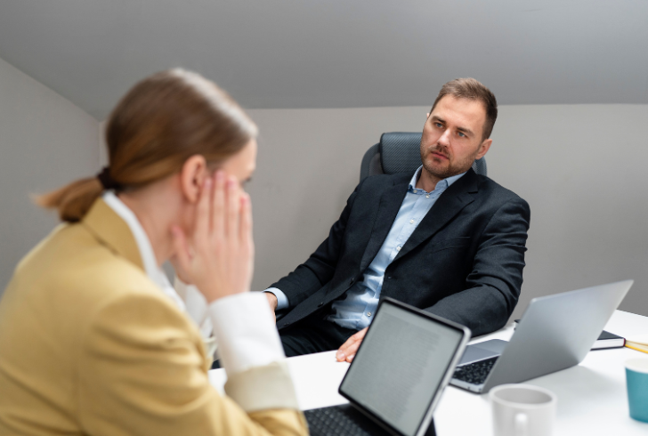 Worker talks with employer about needs